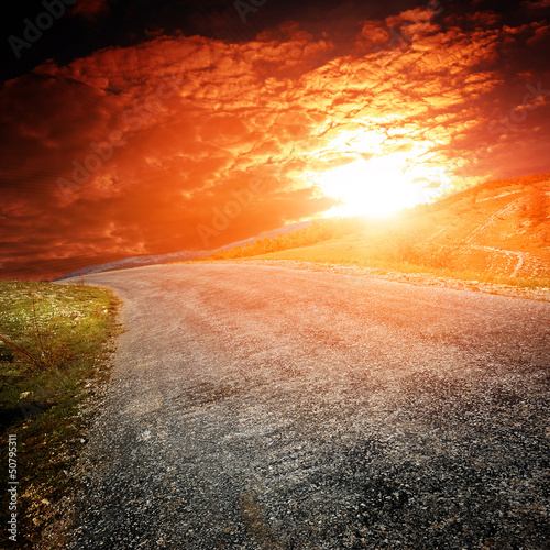 asphalt road with mountians