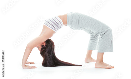 Attractive healthy young woman stretching gym
