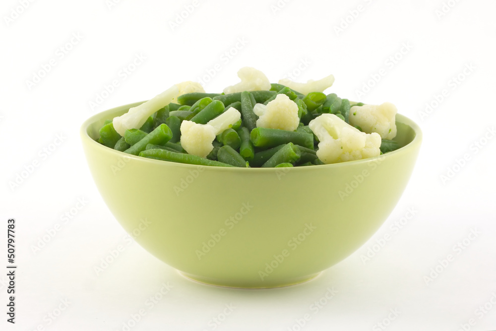 Green beans and cauliflower in green bowl isolated close up Green beans and cauliflower in green bowl isolated close up