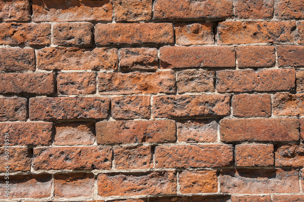 Old weathered red brick wall as background Old weathered red brick wall as background