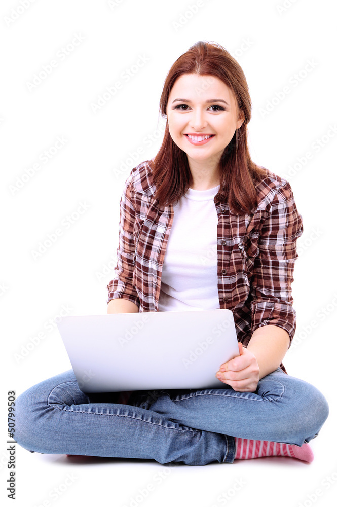 Naklejka premium Beautiful young woman with laptop isolated on white