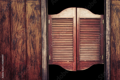 Old vintage wooden saloon doors photo