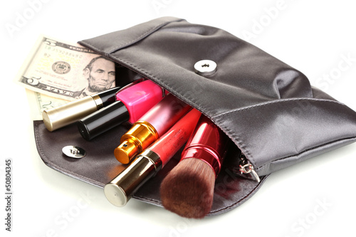 Items contained in the women's handbag isolated on white