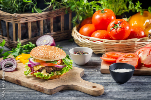 Ingredients and fresh vegetables for homemade hamburger