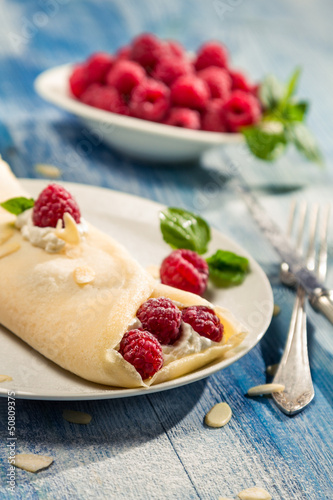 Closeup of pancakes with raspberry