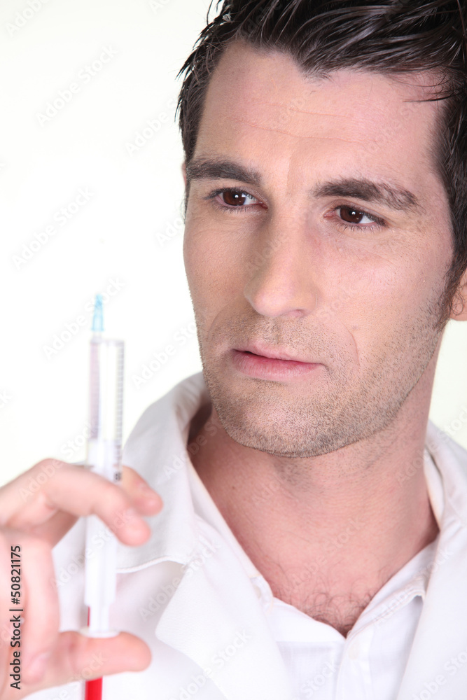 man holding an injection man holding an injection