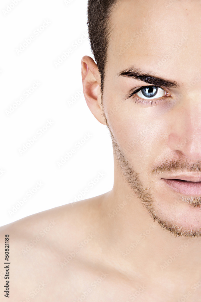 Obraz premium Portrait of a sportive young man isolated on white half face