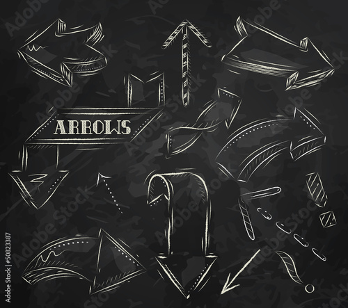 Arrow stylized drawing in chalk on the blackboard