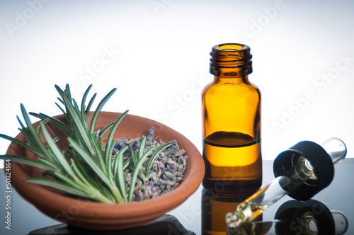Fototapeta Naklejka Na Ścianę i Meble -  essential oil with lavender and rosemary