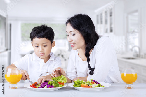 Encourage child to eat salad at home