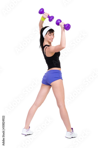 Healthy woman with dumbbells working out