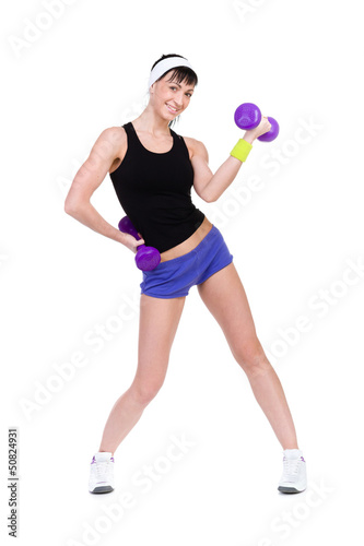 Healthy woman with dumbbells working out
