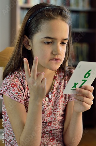 Little Hispanic Girl Doing Math Cards