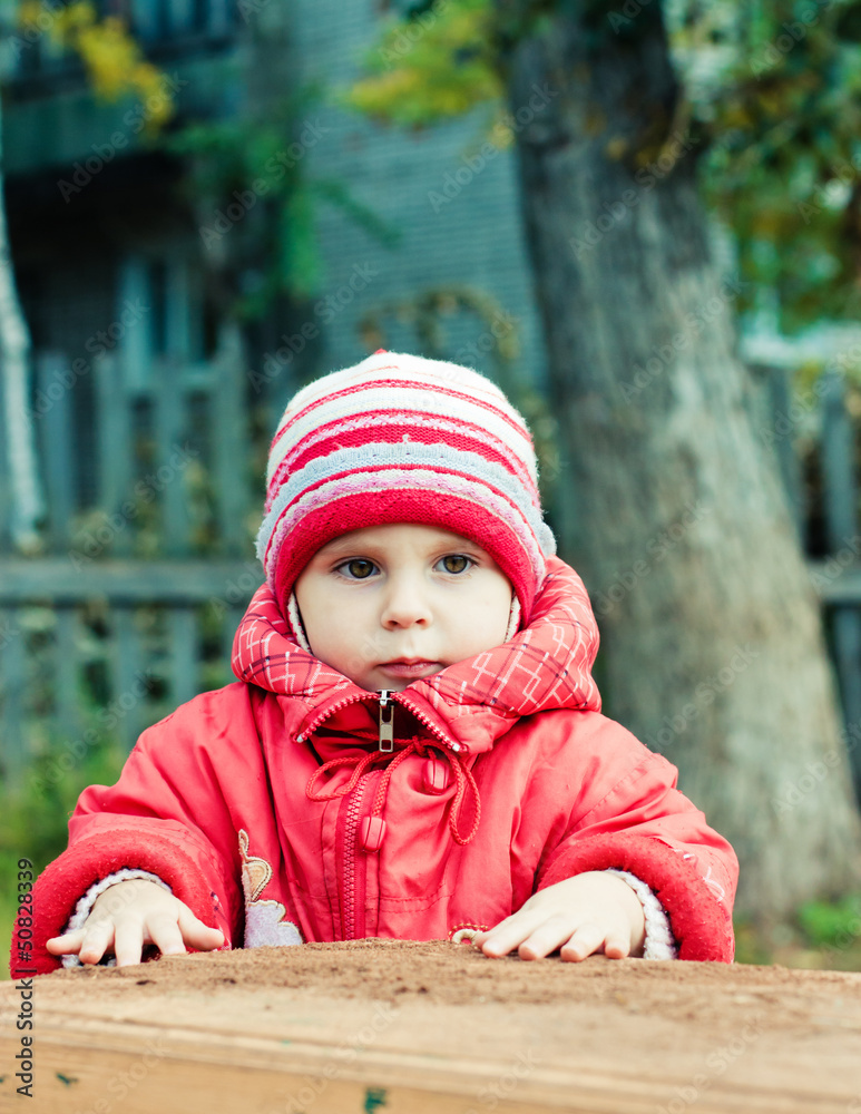 Beautiful happy kid in the red jacket Beautiful happy kid in the red jacket