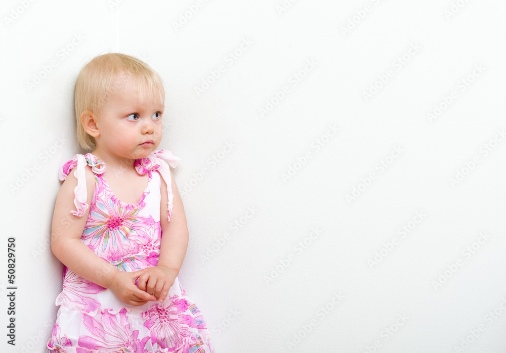 Little girl punished and standing in the corner Little girl punished and standing in the corner