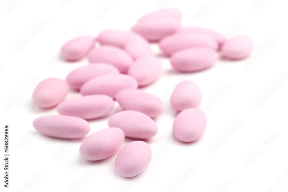 rose sugared almonds on white background