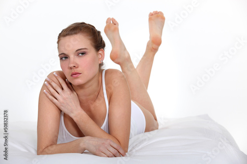Obraz na plátne serious beautiful woman on bed