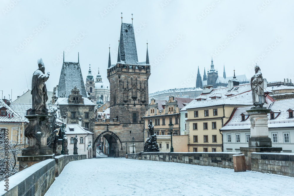Fototapeta premium Snow Covered Charles Bridge in Prague