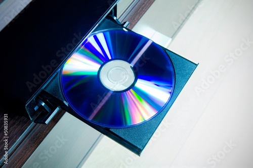 Disc insterted to DVD or CD player photo