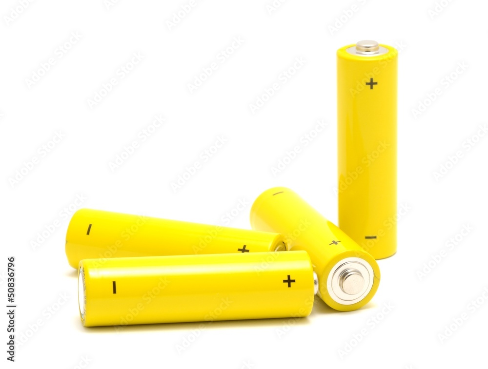 Yellow AA size batteries placed on a white background. Yellow AA size batteries placed on a white background.