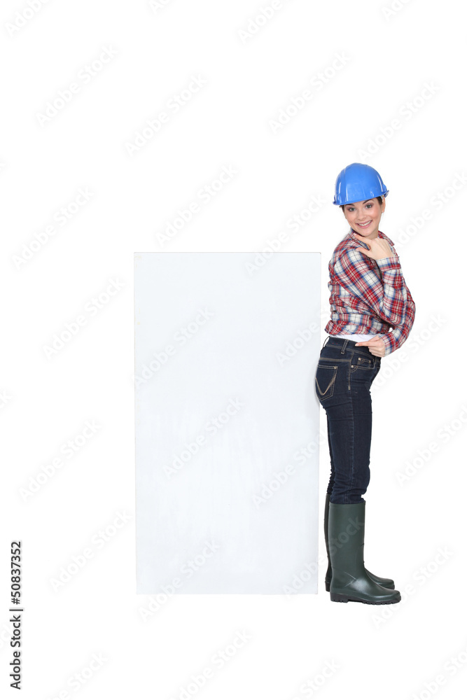 portrait of cute craftswoman pointing at copyspace portrait of cute craftswoman pointing at copyspace