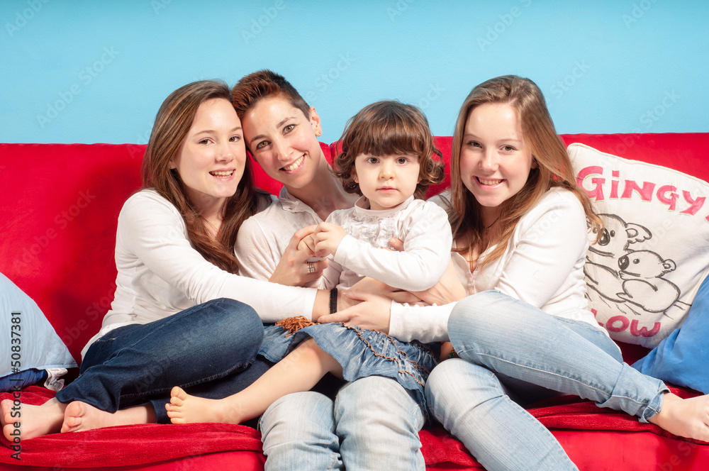 Fototapeta premium happy mother and children on the couch