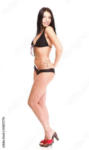 Portrait of sexy brunette in brown bikini isolated