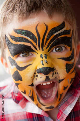 Boy with a tiger make-up