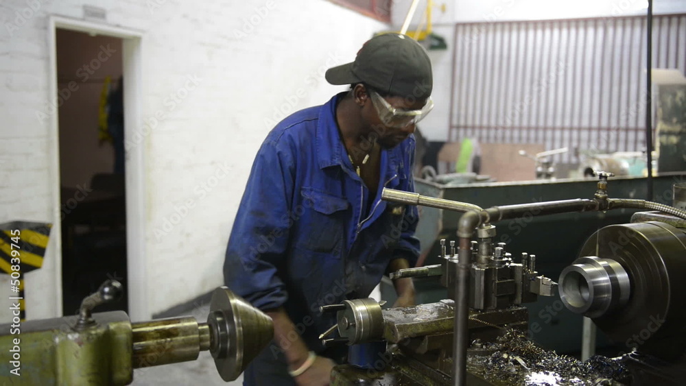 An industrial service repairmen labouring in workshop, selective An industrial service repairmen labouring in workshop, selective