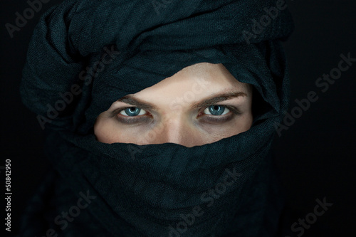 eyes of a beautiful man with black scarf