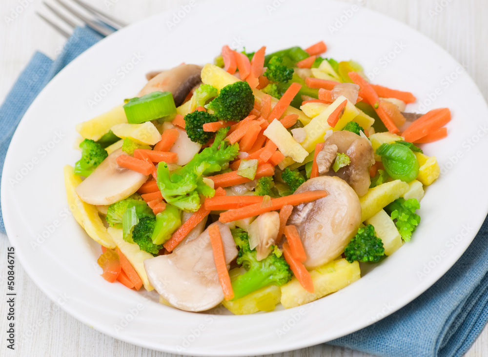 Mixed vegetables with mushrooms on a plate Mixed vegetables with mushrooms on a plate