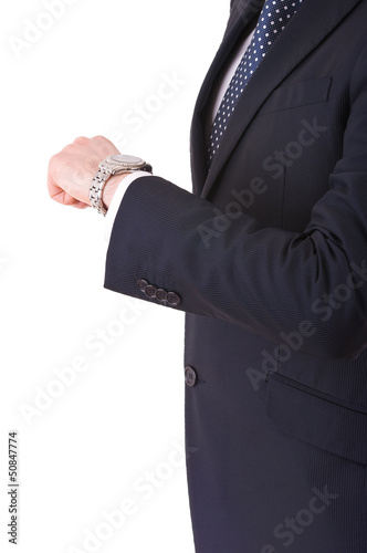 Businessman checking time on his wristwatch.