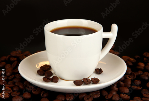 Cup of strong coffee isolated on black