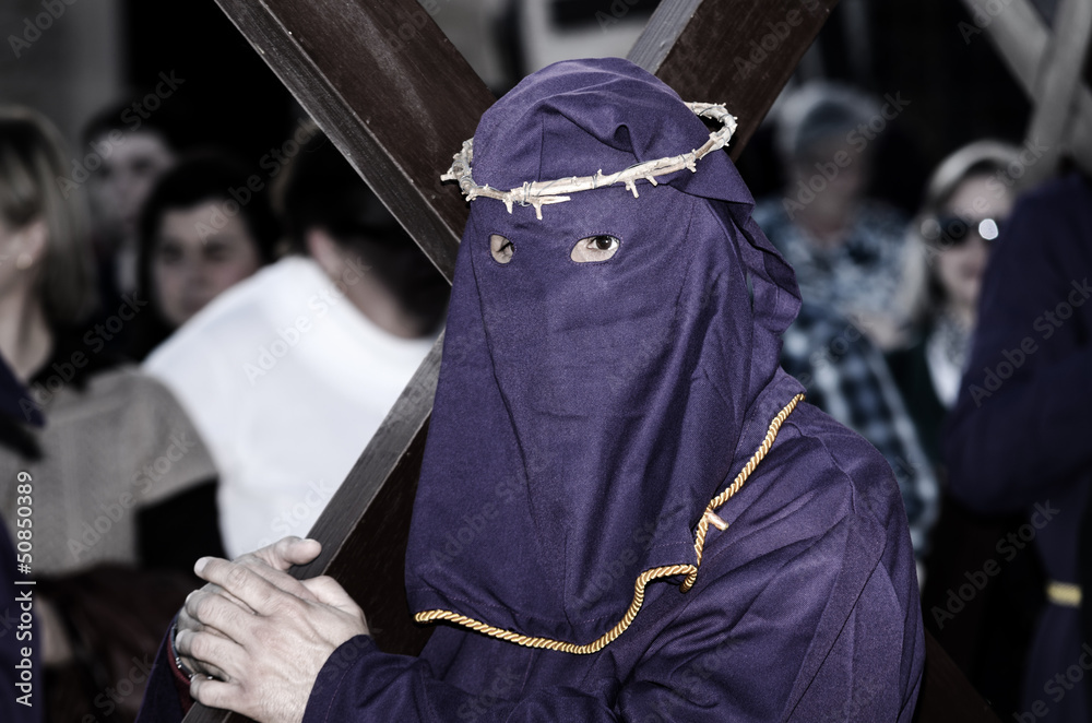 Via Crucis in Lorca, Spain with penitents bearing cross