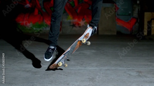 Skater rolling into kickflip trick