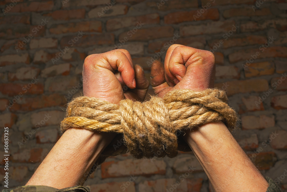 Hands tied up with rope