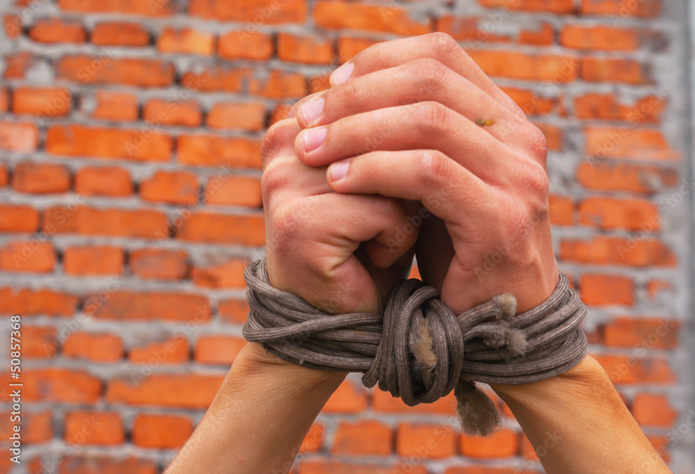 Hands tied up with rope