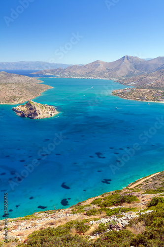 Turquise water of Mirabello bay with Spinalonga island on Crete