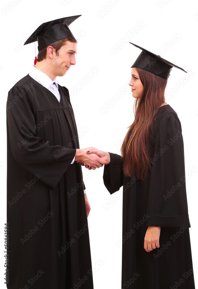 Two happy graduating students isolated on white Two happy graduating students isolated on white