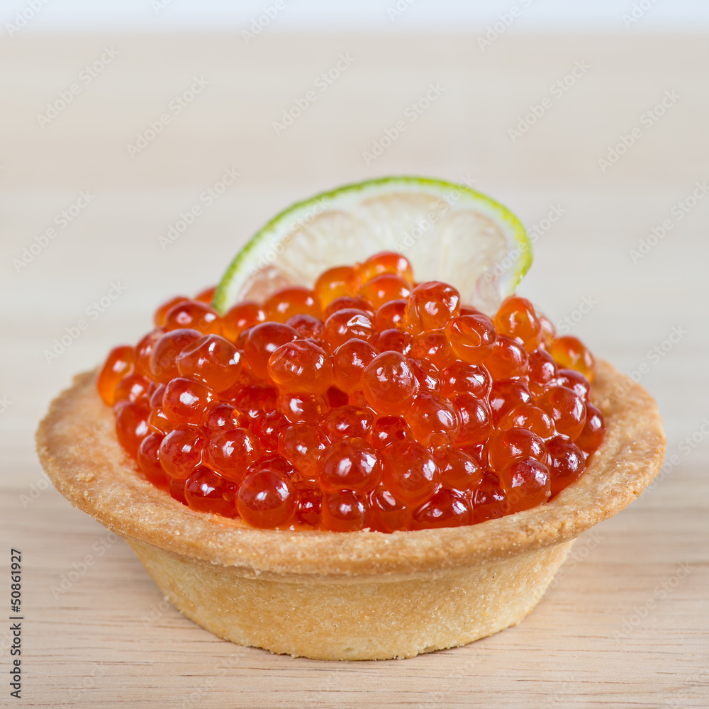 Tartlet with red caviar and lime Tartlet with red caviar and lime