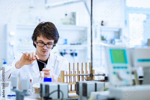 Young male researcher carrying out scientific research in a lab