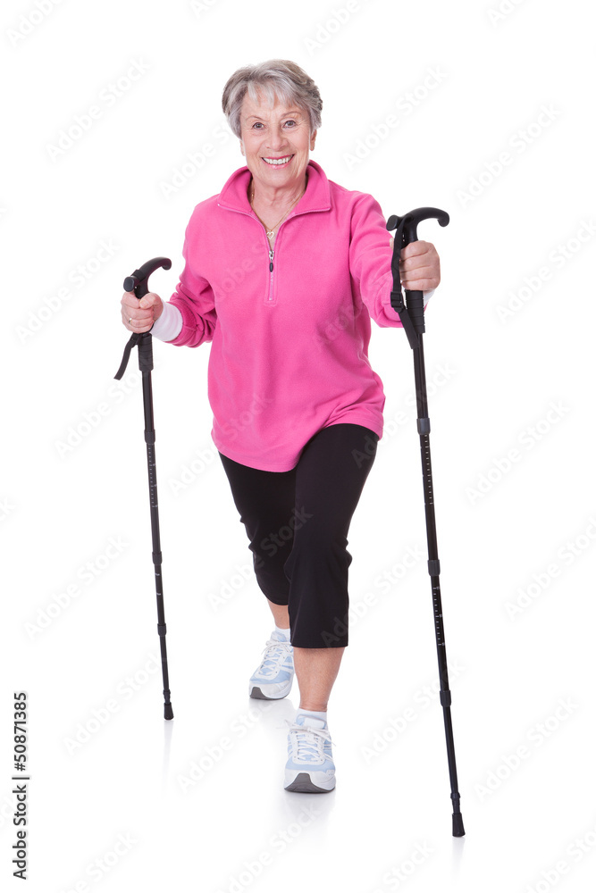 Senior Woman Walking With Hiking Poles