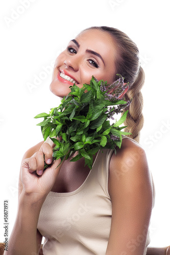 woman with a bundle of fresh mint. Concept vegetarian dieting -