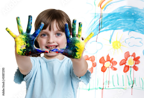 a little girl painting her happy picture