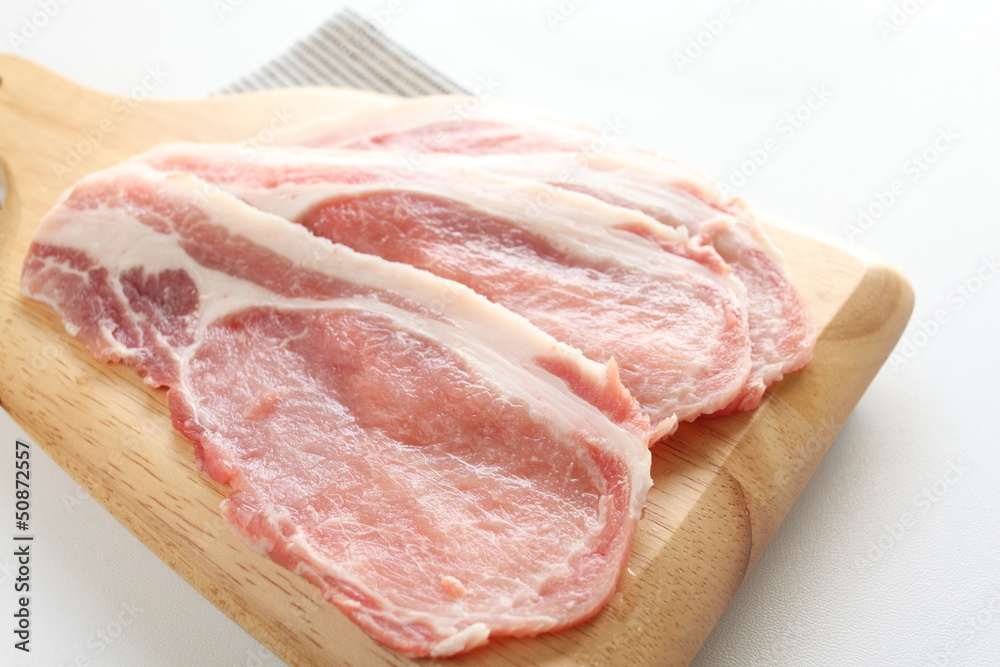freshness slided pork on wooden chopping board freshness slided pork on wooden chopping board