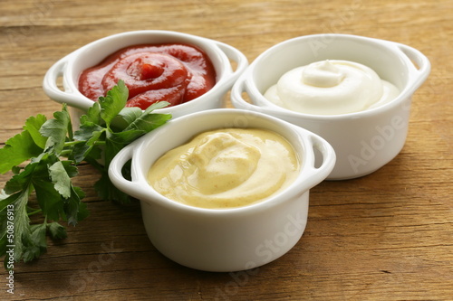 Canvas Print mustard, ketchup and mayonnaise - three kinds of sauces