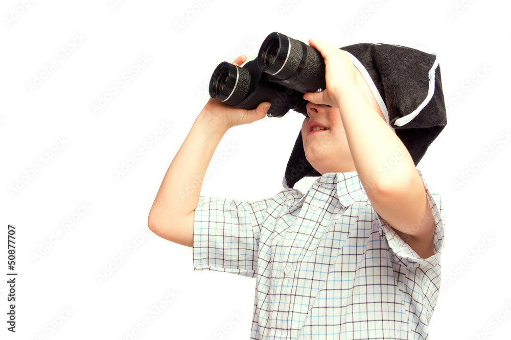 Child in pirate hat looking in binoculars Child in pirate hat looking in binoculars