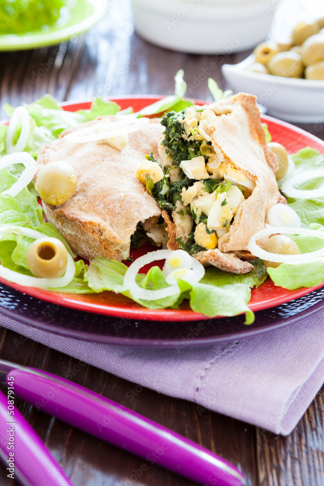 nutritious pie with eggs and spinach and onions