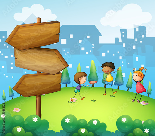 Three kids playing in the hill with wooden arrowboard
