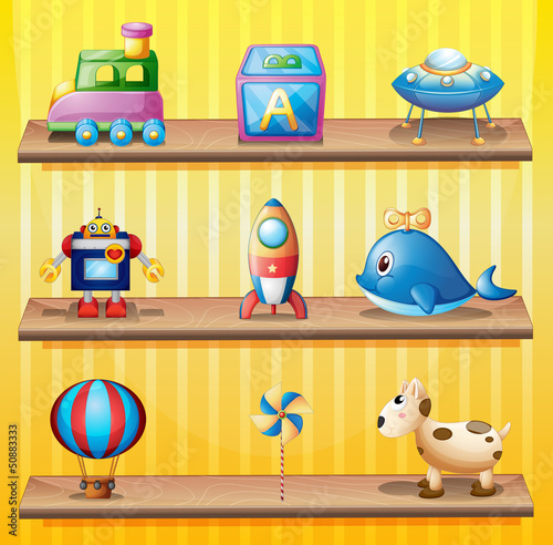 Toys arranged neatly in the wooden shelves